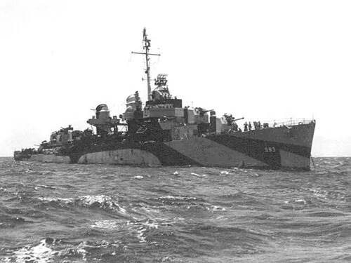 The U.S. Navy destroyer USS Hall (DD-583) at anchor. She is painted in camouflage Measure 32, Design 1D.