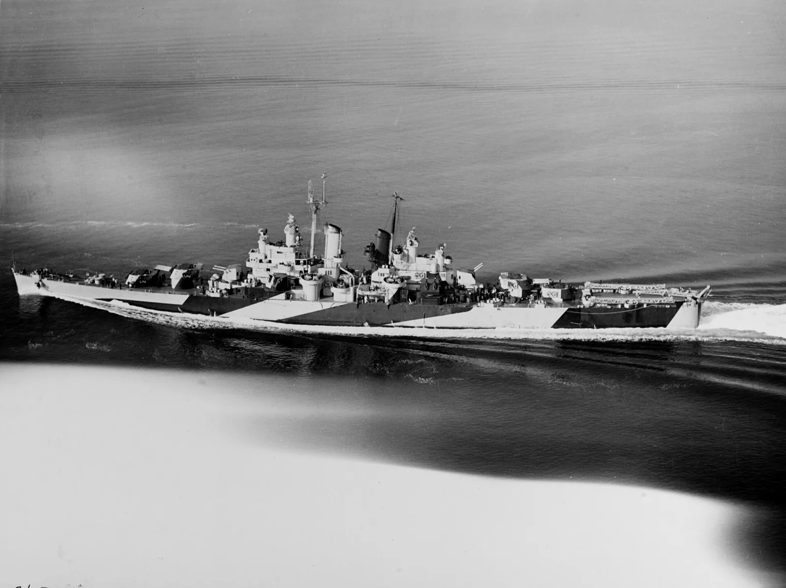 The U.S. Navy light cruiser USS Houston (CL-81) underway off the U.S. East Coast, 26 January 1944. She is painted in Camouflage Measure 32, Design 1d.