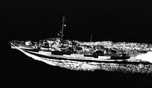 USS Formoe (DE-509) underway in the Atlantic Ocean on 25 October 1944. She is painted in Camouflage Measure 32, Design 3D. The photo was taken by an aircraft from Naval Air Station New York.