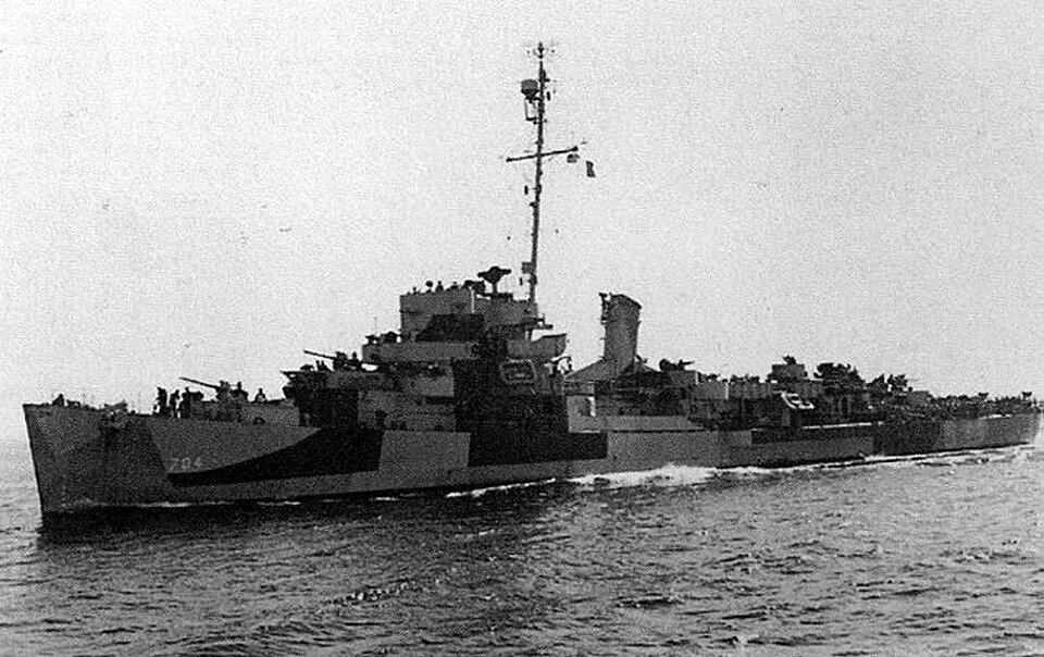 The U.S. Navy destroyer escort USS Cronin (DE-704) underway at sea, circa in 1944. She is painted in Camouflage Measure 32, Design 3D.