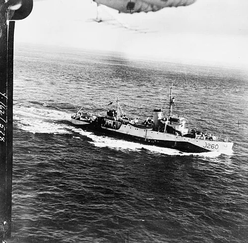 Aerial view of the Canadian Bangor class minesweeper HMCS Goderich (J260). Visible at top centre are two aerial depth charges and a Yagi antenna for Mark II ASV radar.