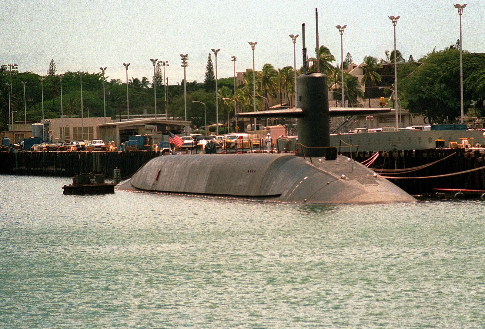 A starboard view of the nuclear-powered strategic missile submarine USS GEORGIA (SSBN-729) moored to a pier. Location: NAVAL STATION, PEARL HARBOR, HAWAII (HI) UNITED STATES OF AMERICA (USA)