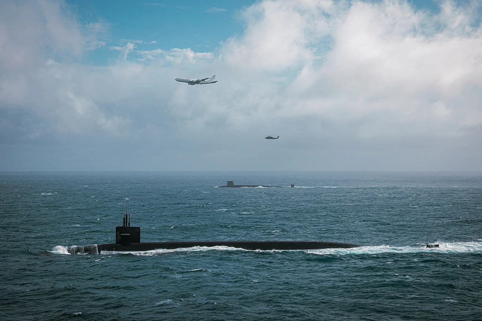 USS Tennessee (SSBN-734), a Royal Navy Vanguard -class ballistic missile submarine, a Boeing E-6B Mercury assigned to Fleet Air Reconnaissance Squadron 4 (VQ-4) "Shadows" and a Sikorsky MH-60R Sea Hawk of Helicopter Mari…