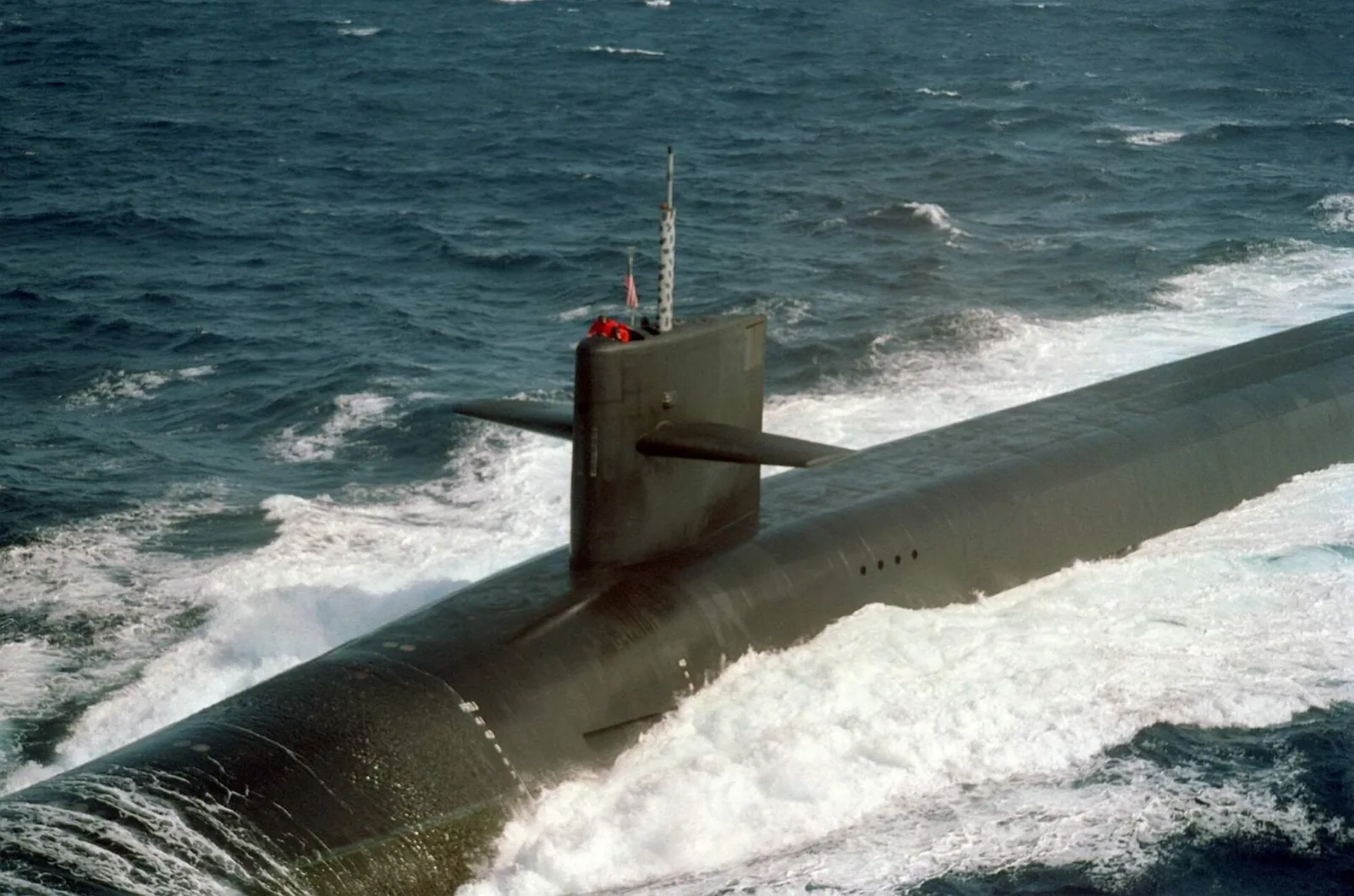 An aerial view showing the sail structure of the U.S. Navy's nuclear-powered strategic missile submarine, Kentucky (SSBN-737) on 1 January 1992.