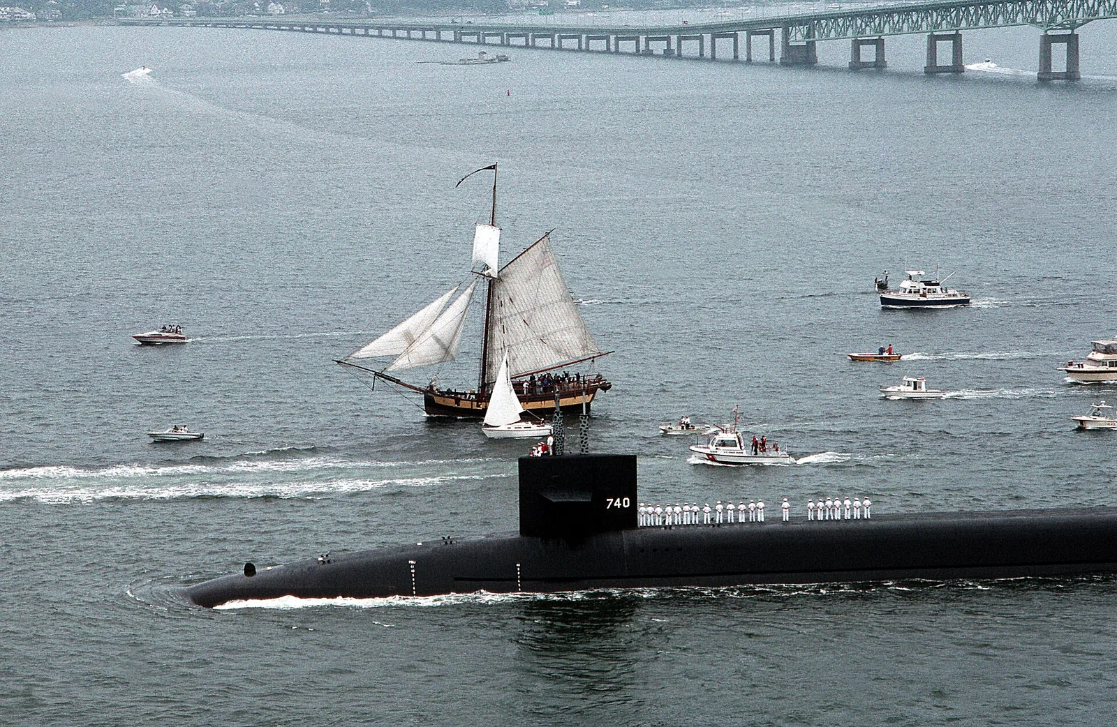 USS RHODE ISLAND (SSBN-740) passing underneath the Pell Newport Bridge after departing Newport for builder's trials off the New England coast. A re...