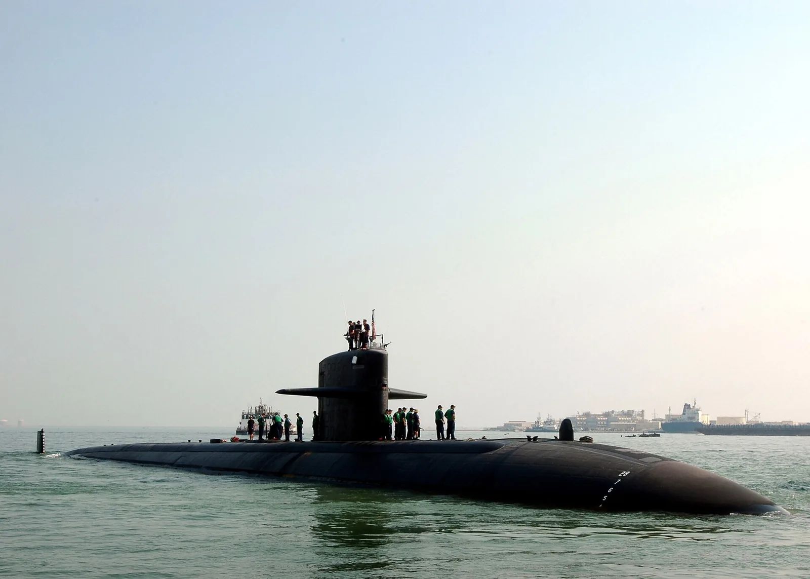 USS Philadelphia (SSN 690) stand topside as the submarine gets underway. Philadelphia is underway on a scheduled deployment. U.S. Navy photo by Mass Communication Specialist 3rd Class Octav...