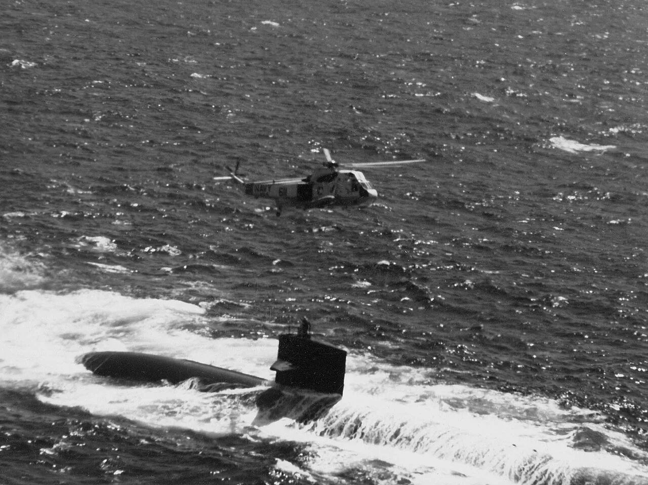 USS Phoenix (SSN-702) transferring personnel. The submarine was backing down at one knot into the wind to provide a more stable platform....