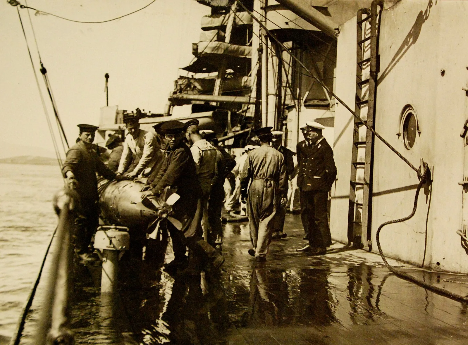 Lot 9609-36: Royal Navy (British) during the First World War. Royal Navy Iron-Duke class battleship HMS Emperor of India. Her crew recovers a torpedo after a trial run. She was sold for scrap in 1932.