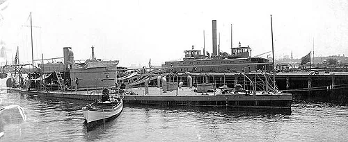 A cropped photograph of the USS Lehigh during the Spanish-American War. The ship on the opposite side of the pier is USS Governor Russell.