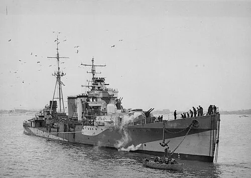 Royal Navy C-class light cruiser HMS Colombo moored to a buoy in Plymouth Sound. Configured as a Anti-Aircraft Ship.