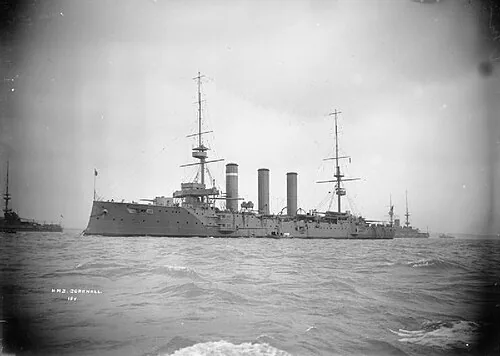 IWM caption : A portrait of the Royal Navy Monmouth Class Armoured Cruiser HMS CORNWALL at sea.