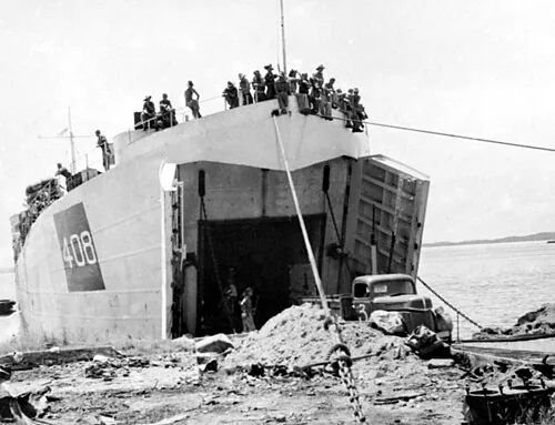 HM LST-408 unloading rations and members of British Borneo Civil Affairs Unit (BBCAF) at Borneo, 18 October 1945.