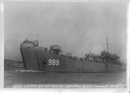 The USS LST 989 was being used to transport Japanese refugees from Taku, China to Sasebo, Japan.